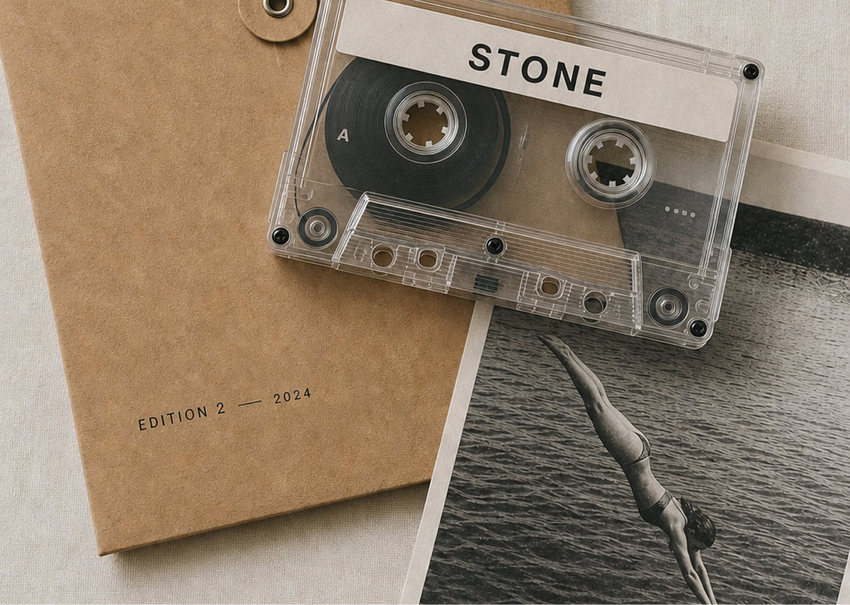 Edition 2 — 2024. Cassette, kraft portfolio, and a dive print.